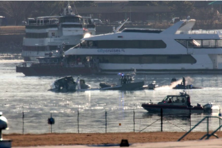 Emergency response units search the wreckage on Jan. 30, 2025, of an American Airlines plane on the Potomac River after it crashed on approach to Reagan National Airport the night before. The American Airlines flight from Wichita, Kansas, collided midair with a military Black Hawk helicopter while on approach to Ronald Reagan Washington National Airport. According to reports, there were no survivors among the 67 people on both aircraft. | Credit: Alex Wong/Getty Images
